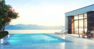Villa contemporaine avec une piscine à débordement donnant sur la mer